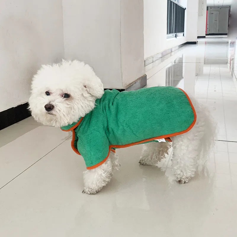 Wet dog drying quickly in a Pawbe robe after swimming